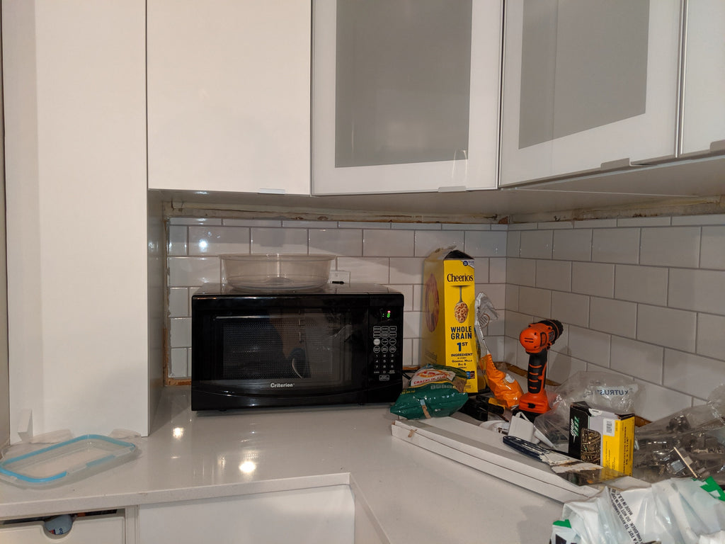 How to replace drywall adjacent to wall cabinets and then tile over it?